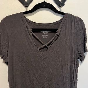 Dark grey American eagle tee shirt with criss cross detail